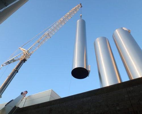 建设 crane placing stainless steel vessels at Hood Dairy Facility.